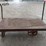 heavy-duty-steel-platform-cart-with-dual-handles-and-cast-iron-wheels-image-3