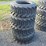 new-4-forerunner-12-16.5-skidloader-tires-image-1
