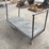 heavy-duty-steel-platform-cart-with-dual-handles-and-four-wheels-image-1
