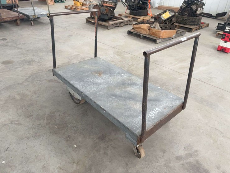 heavy-duty-steel-platform-cart-with-dual-handles-and-four-wheels-image-1