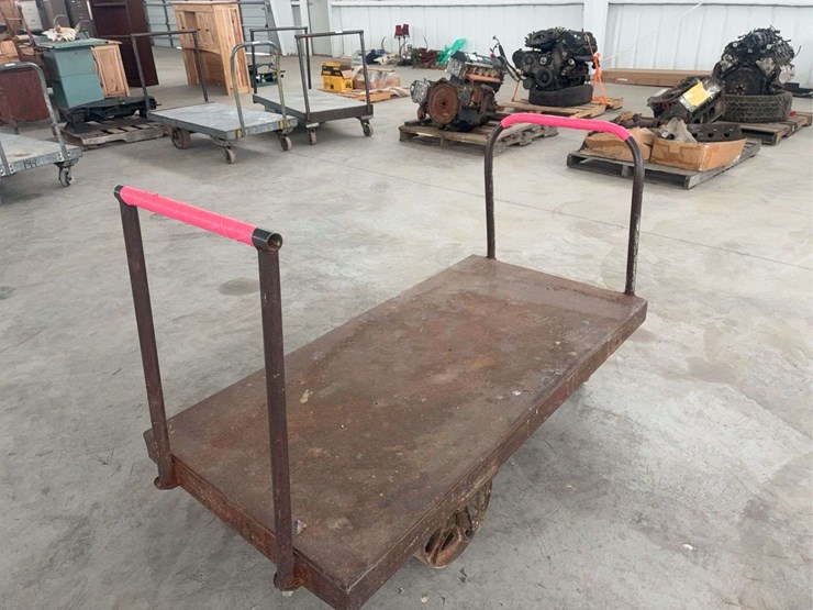 heavy-duty-steel-platform-cart-with-dual-handles-and-cast-iron-wheels-image-1