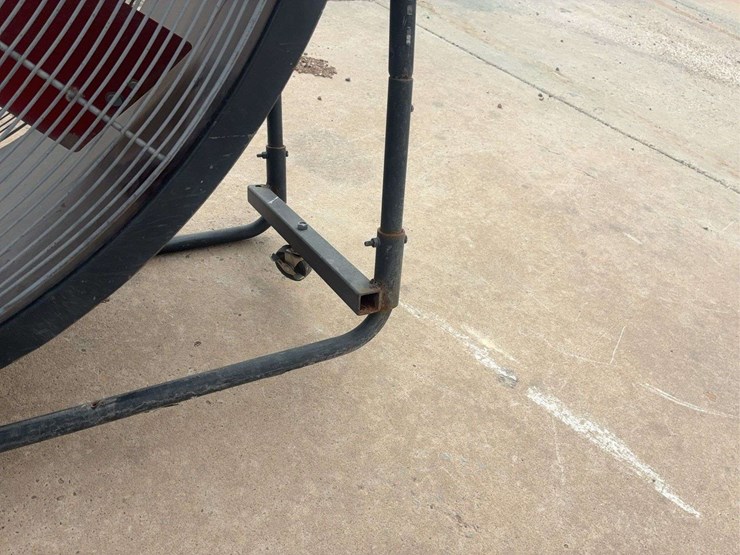 large-industrial-floor-fan-with-metal-frame-and-red-blades-image-2