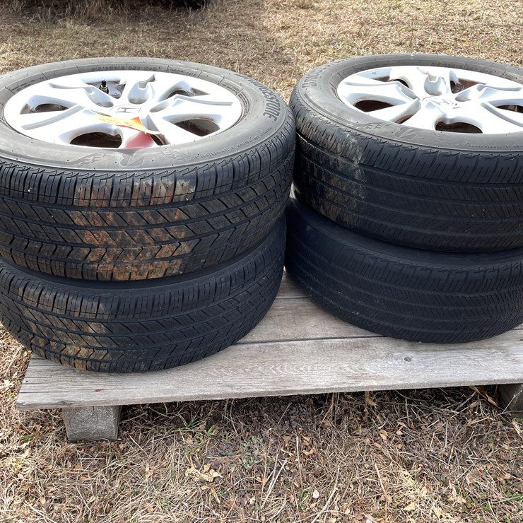 #10703 • (4) Bridgestone 16" Tires on Honda 5-Bolt Aluminum Rims