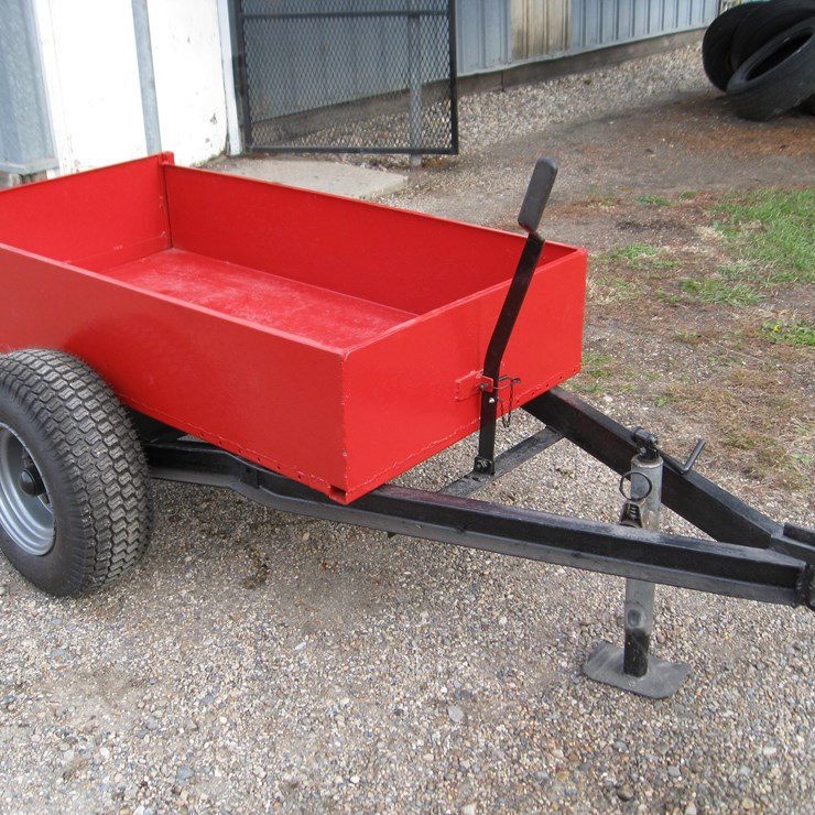Seller #13.  Heavy Duty tilt bed garden trailer, 28”x53”, 12” sides, 20x8x10 new tires, removable end gate