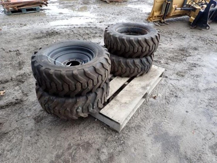 qty-of-(4)-titan-10-16.5-tire(s)-&-rim(s)-image-1