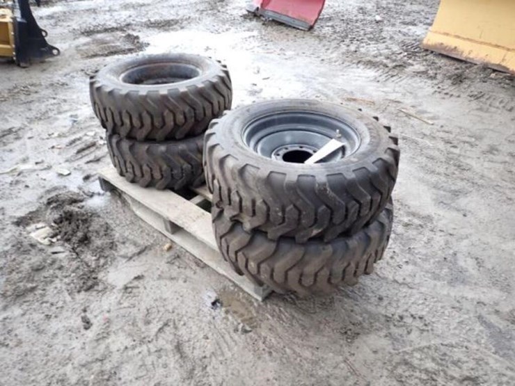 qty-of-(4)-titan-10-16.5-tire(s)-&-rim(s)-image-2