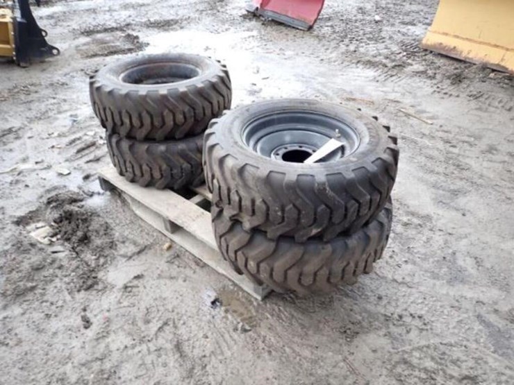 qty-of-(4)-titan-10-16.5-tire(s)-&-rim(s)-image-2