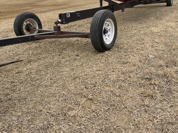 seller-#10.--straight-header-transport,-adjustable-20’-–-30’,-works-great,-has-a-pivot-trailer-in-front-of-the-hitch,-was-made-in-bisbee-at-vulcan-ironworks-image-1