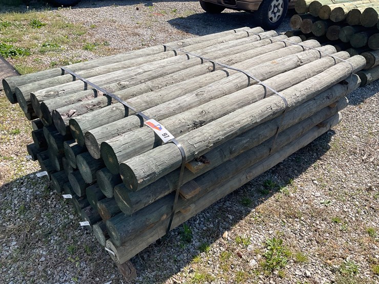 #97-•-4”x7’-treated-wooden-fence-posts-image-1
