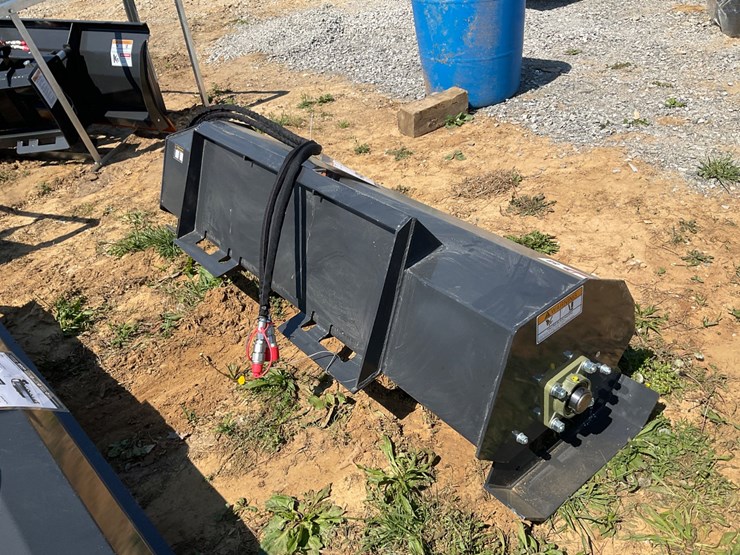 #58-•-unused-wolverine-skid-steer-hydraulic-rotary-tiller-attachment-image-2