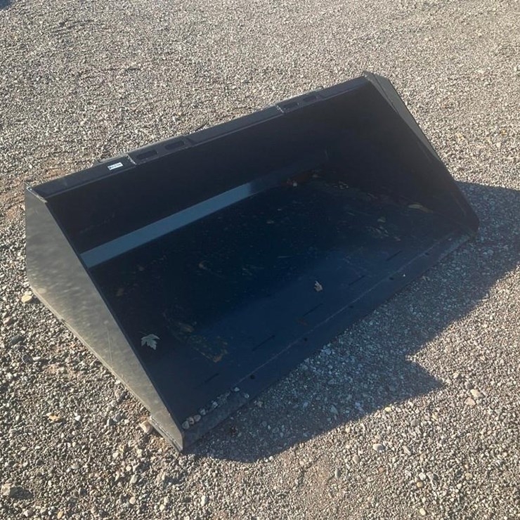 #1409 • Unused Wolverine Skid Steer Track Duty Bucket Attachment