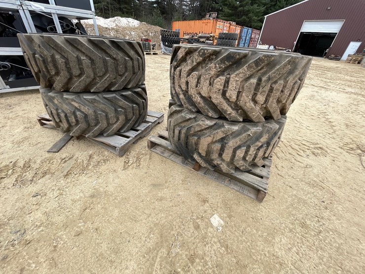 #7540-•-set-of-(4)-outrigger-brand-boom-lift-tires-on-rims-image-2