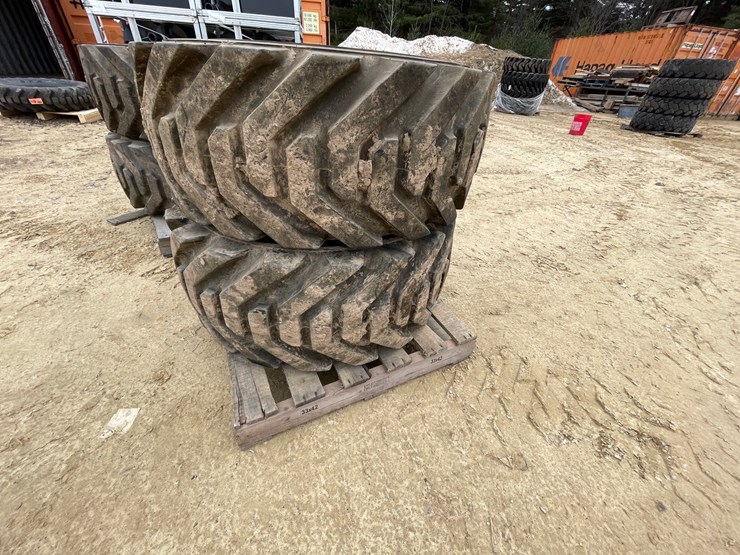 #7540-•-set-of-(4)-outrigger-brand-boom-lift-tires-on-rims-image-14