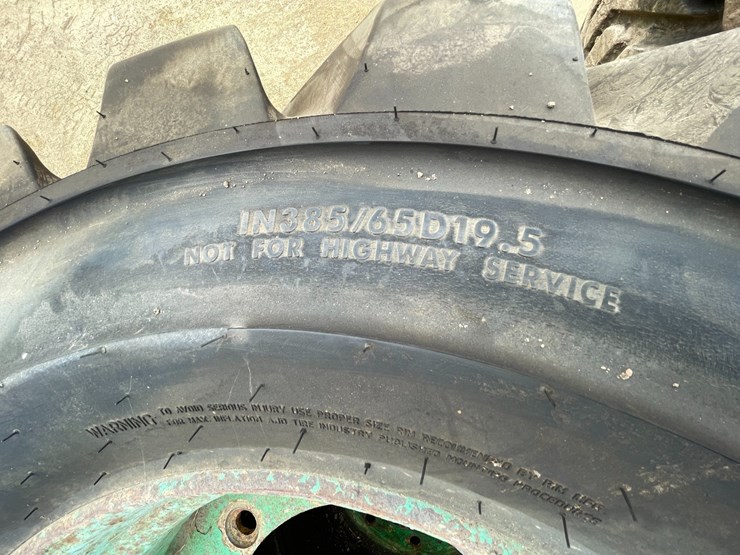 #7540-•-set-of-(4)-outrigger-brand-boom-lift-tires-on-rims-image-10