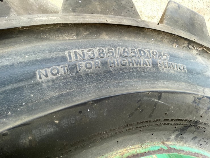 #7540-•-set-of-(4)-outrigger-brand-boom-lift-tires-on-rims-image-19