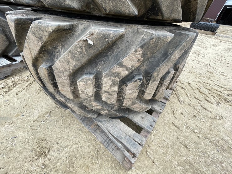 #7540-•-set-of-(4)-outrigger-brand-boom-lift-tires-on-rims-image-22