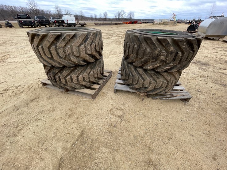 #7540-•-set-of-(4)-outrigger-brand-boom-lift-tires-on-rims-image-1