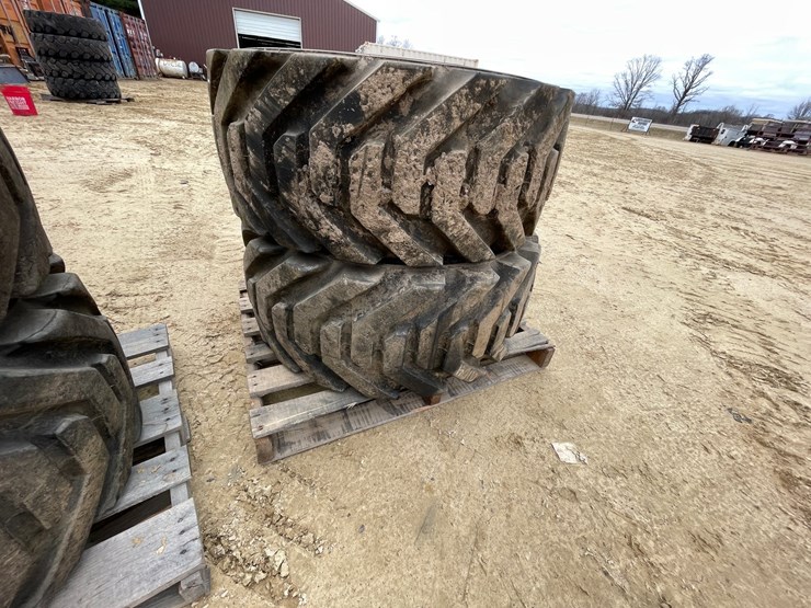 #7540-•-set-of-(4)-outrigger-brand-boom-lift-tires-on-rims-image-13