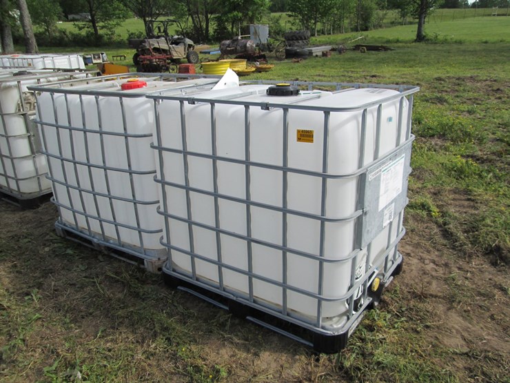 #45965-•-lot-of-(2)-250gal-plastic-tote-w/-cages-image-1