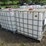 #45967-•-lot-of-(2)-250gal-plastic-tote-w/-cages-image-1