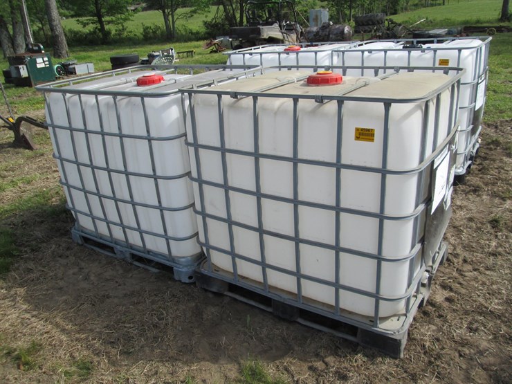 #45967-•-lot-of-(2)-250gal-plastic-tote-w/-cages-image-1