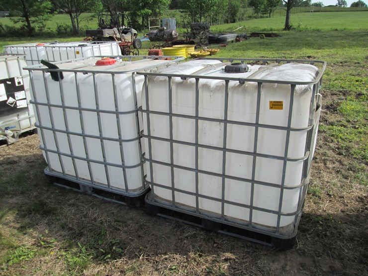 #45966-•-lot-of-(2)-250gal-plastic-tote-w/-cages-image-1