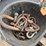 #1028-•-pail-of-assorted-clevises-image-3