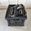 milk-crate-containing-a-multitude-of-metal-frame-picture-frames-image-1
