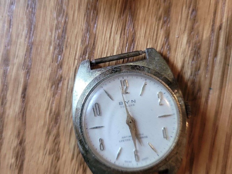 collection-of-assorted-wristwatches,-leather-wallets,-and-money-clips-image-5