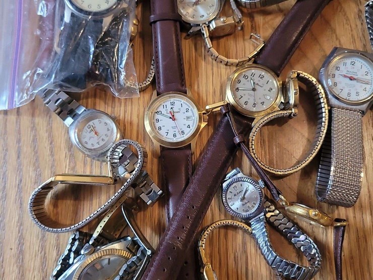 collection-of-assorted-wristwatches,-leather-wallets,-and-money-clips-image-3