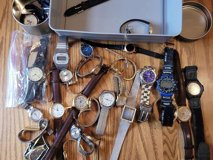 collection-of-assorted-wristwatches,-leather-wallets,-and-money-clips-image-2