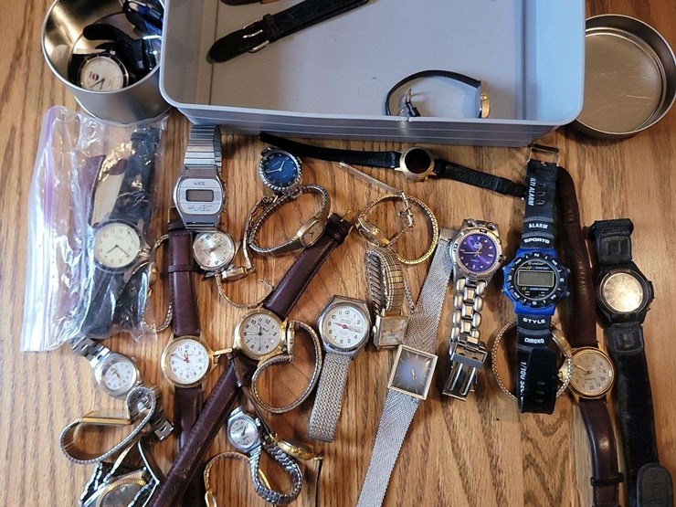 collection-of-assorted-wristwatches,-leather-wallets,-and-money-clips-image-1