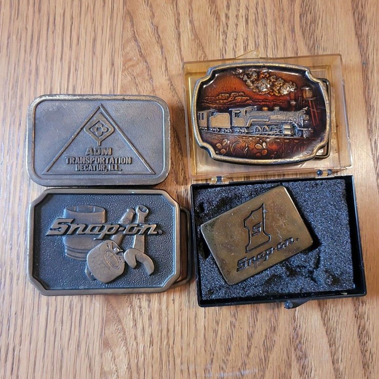 Collection of Four Assorted Metal Belt Buckles Including Snap-on and ADM Transportation