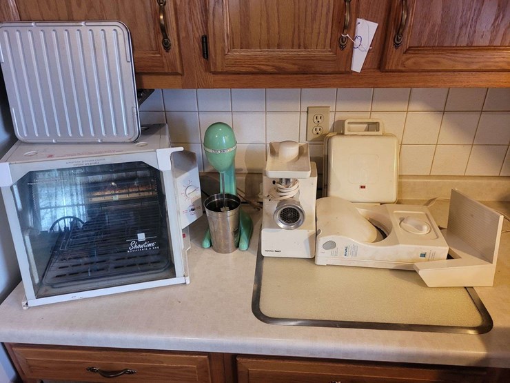 collection-of-kitchen-appliances-including-ronco-rotisserie,-hamilton-beach-mixer,-meat-grinder,-and-rival-slicer-image-1