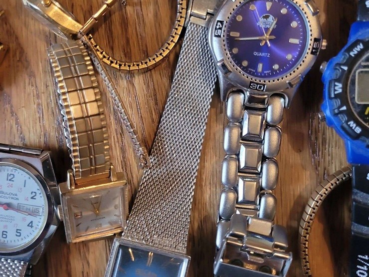 collection-of-assorted-wristwatches,-leather-wallets,-and-money-clips-image-8