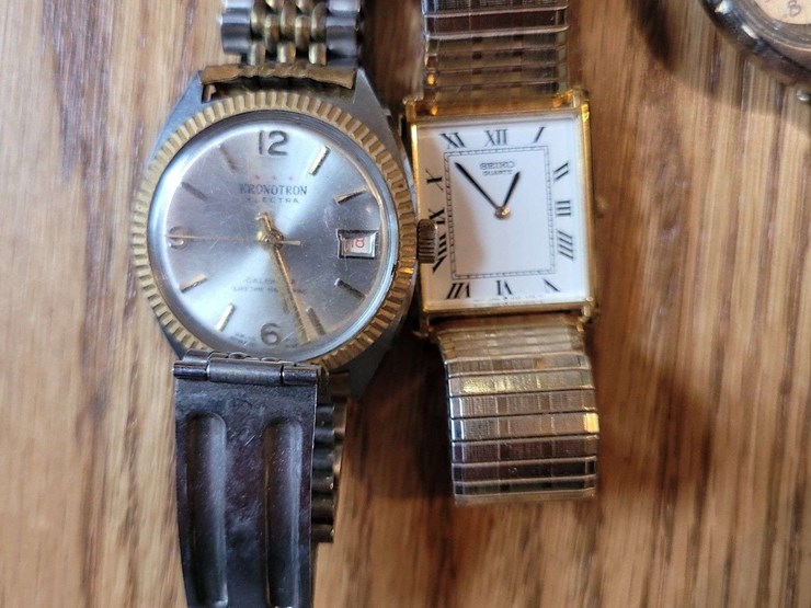 collection-of-assorted-wristwatches,-leather-wallets,-and-money-clips-image-4