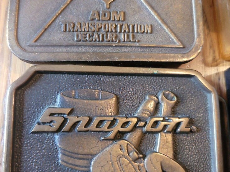 collection-of-four-assorted-metal-belt-buckles-including-snap-on-and-adm-transportation-image-2