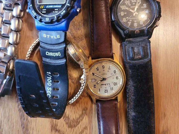 collection-of-assorted-wristwatches,-leather-wallets,-and-money-clips-image-9