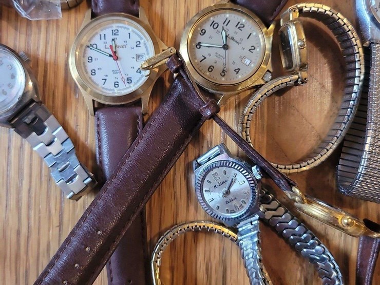 collection-of-assorted-wristwatches,-leather-wallets,-and-money-clips-image-6