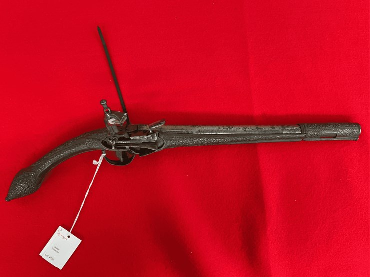 flintlock-miquelet-pistol-with-ornate-metalwork-image-1