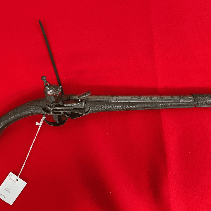 Flintlock Miquelet Pistol with Ornate Metalwork