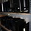 three-shelves-of-desktop-computers-&-flat-screen-monitors-image-1