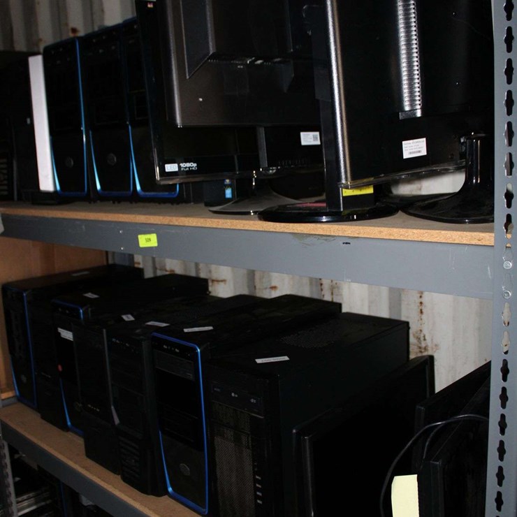 THREE SHELVES OF DESKTOP COMPUTERS & FLAT SCREEN MONITORS