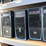 four-shelves-of-desktop-computers-&-flatscreen-monitors-(cooler-master-computers)-image-4