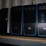 three-shelves-of-desktop-computers-&-flat-screen-monitors-image-3