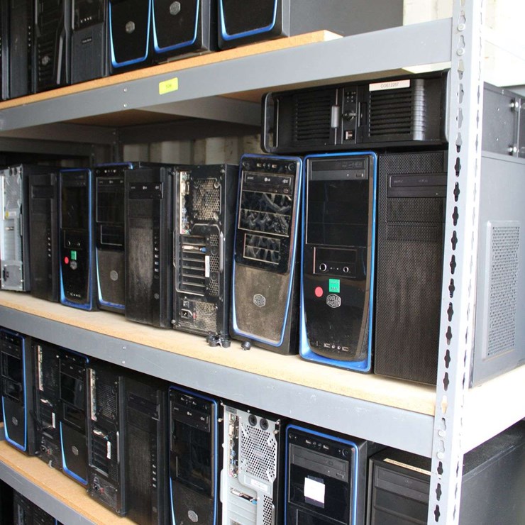 FOUR SHELVES OF DESKTOP COMPUTERS