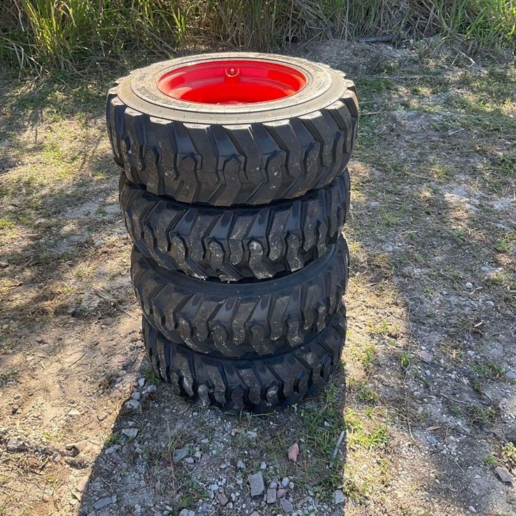 Set of 4 Unused 10-16.5N.H.S. ForeRunner Skid Steer Wheels and Tires