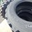 set-of-4-unused-10-16.5n.h.s.-forerunner-skid-steer-tires-image-4
