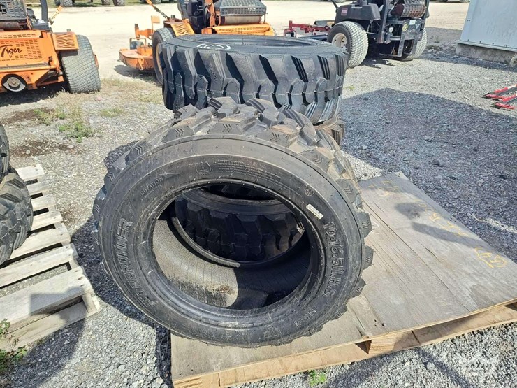 set-of-4-unused-10-16.5n.h.s.-forerunner-skid-steer-tires-image-1