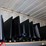 three-shelves-of-flat-screen-monitors-&-one-lg-flat-screen-tv-image-3